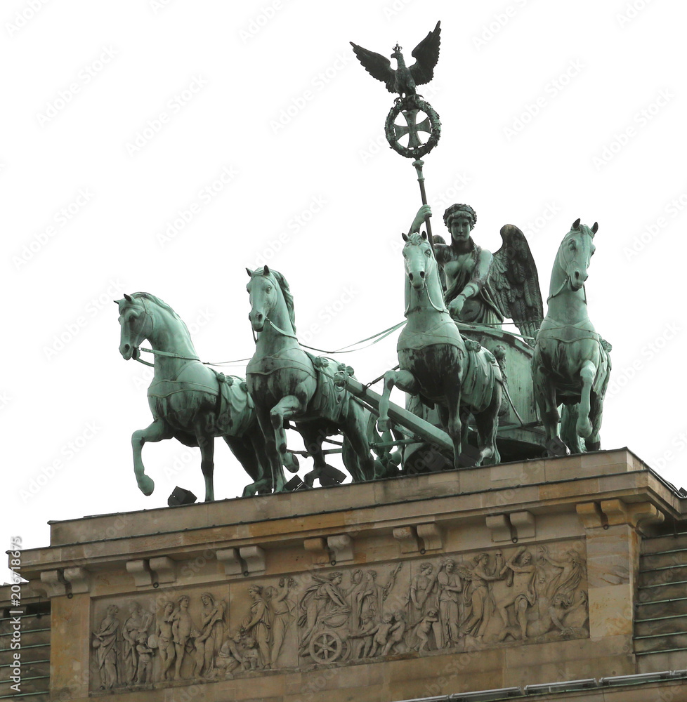 Four horses and the quadriga over the Brandenburg Gate in Berlin