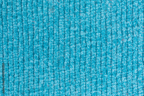 background of knitted chenille yarn in turquoise photo