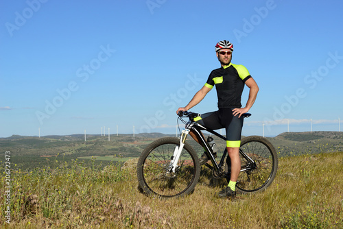 Young sportsman with his mountain bike.