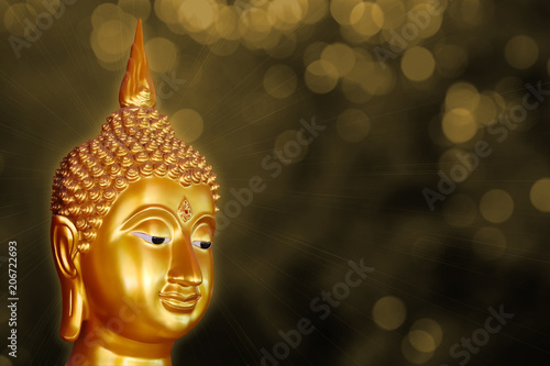 Golden Buddha from Thailand on bokeh background © Sathaporn