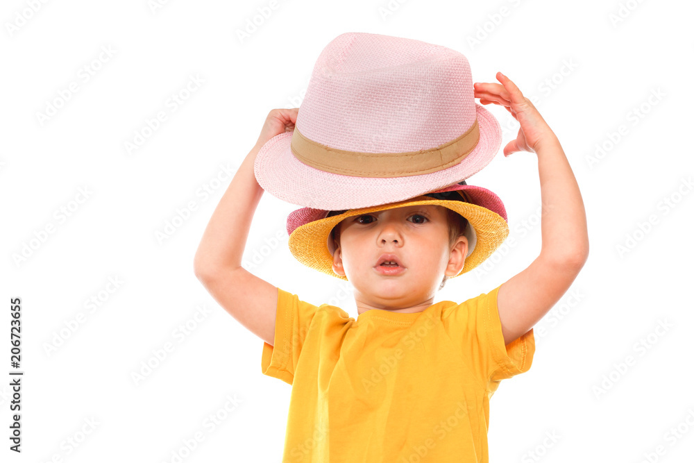 Little caucasian boy in hat is dancing, isolated white. Little cute cheerful humor kid is dancing on white background. Little caucasian boy in hat is dancing, isolated white. Little cute cheerful humor kid is dancing on white background.