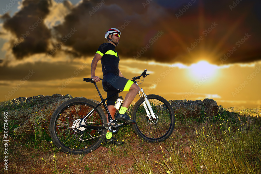 Young sportsman with his mountain bike.