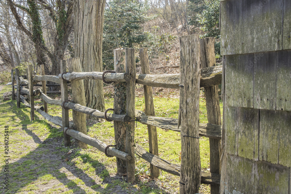 Unusual split-rail fence with horse shoes