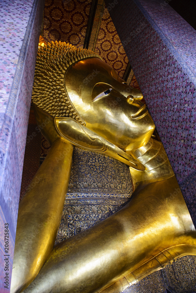 Reclining buddha gold statue. Wat Pho, Bangkok, Thailand