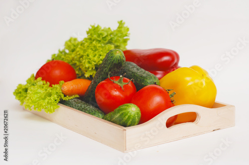 Fresh Summer Vegetables in Wooden Box Isolated. Organic Vegetables Vegetarian Vegan Health food Eatting