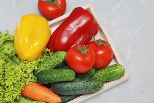Fresh Summer Vegetables in Wooden Box Isolated on Textured Gray Backgroung. Organic Vegetables Vegetarian Vegan Health food Eatting