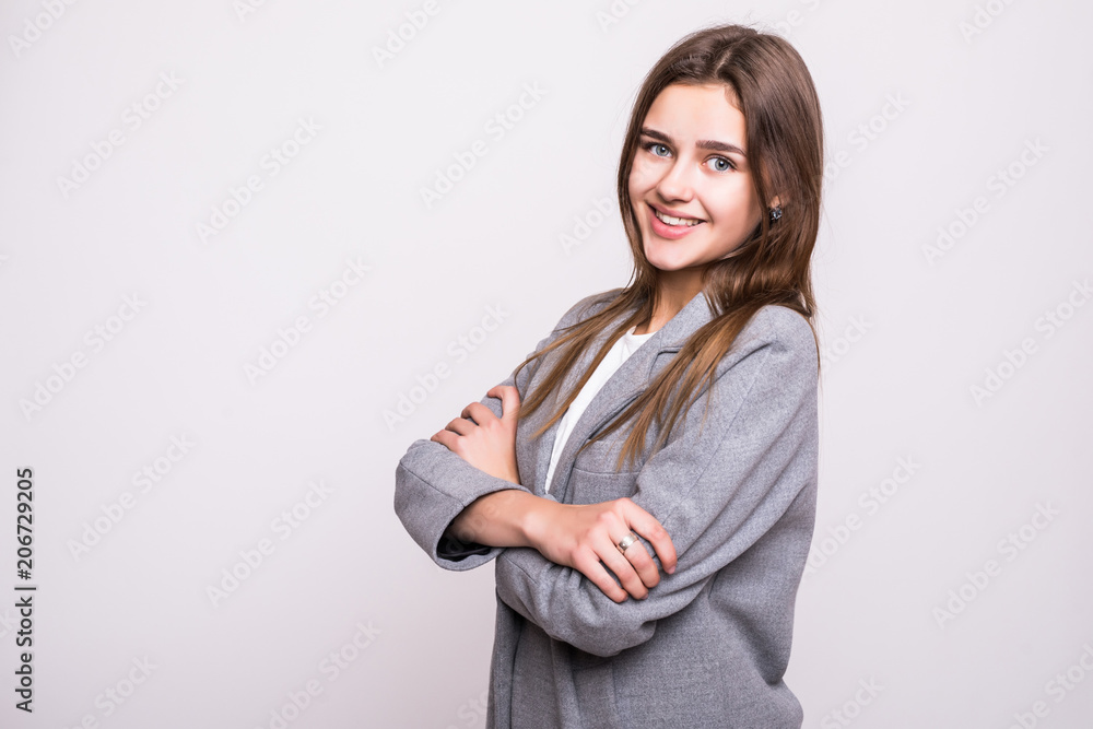 Smiling business woman with folded hands against white background. Toothy smile, crossed arms. Smiling business woman with folded hands against white background. Toothy smile, crossed arms.