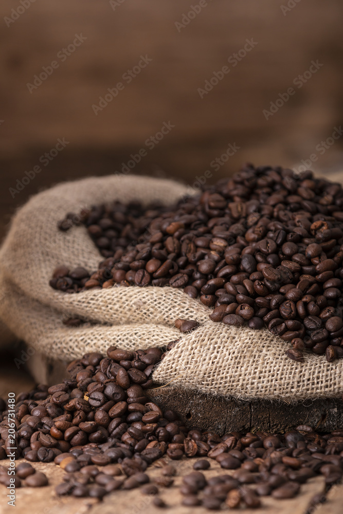 Fototapeta premium Sack of spilled roasted coffee beans