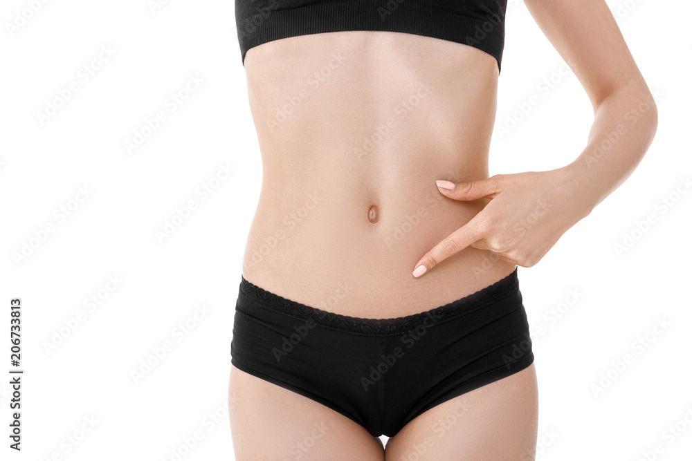 Hand on fit slim woman belly Hand on fit slim woman belly