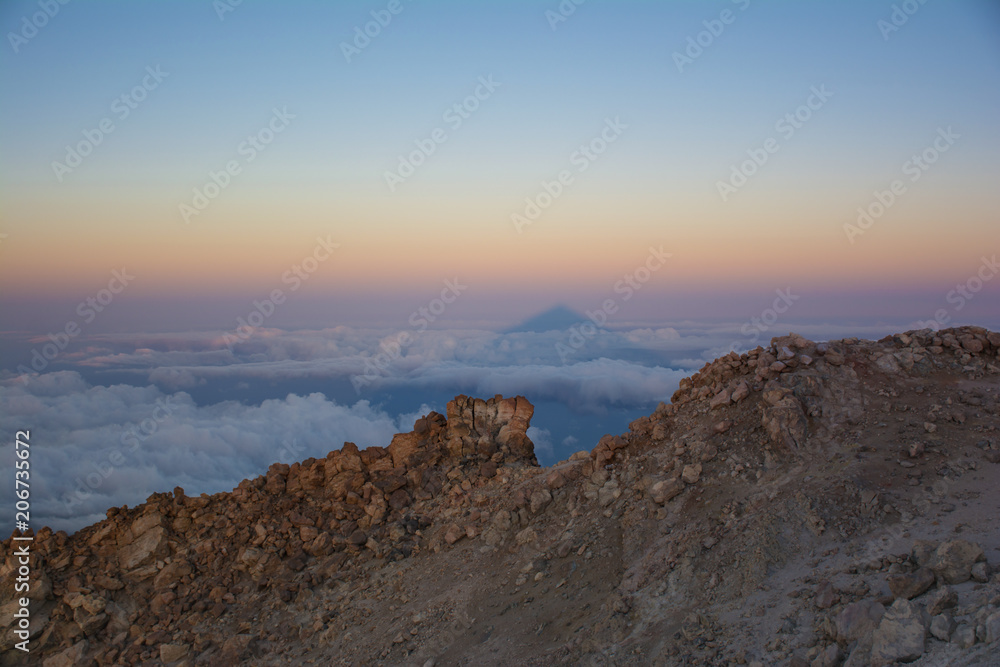 The shadow of Teide Mount at sunrise. Beautiful view from the top of the Teide Volcano, Tenerife  Island, Canary