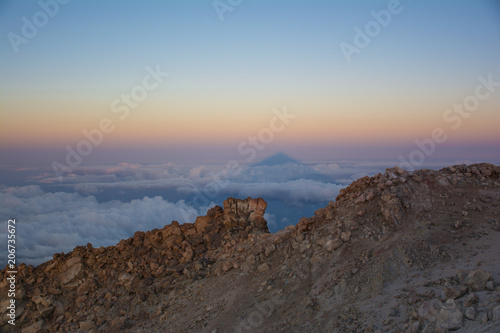 The shadow of Teide Mount at sunrise. Beautiful view from the top of the Teide Volcano, Tenerife Island, Canary