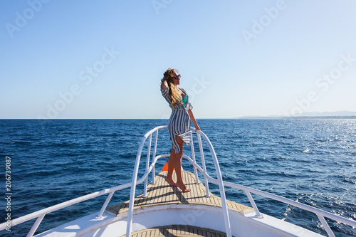 girl traveling on yacht across the sea