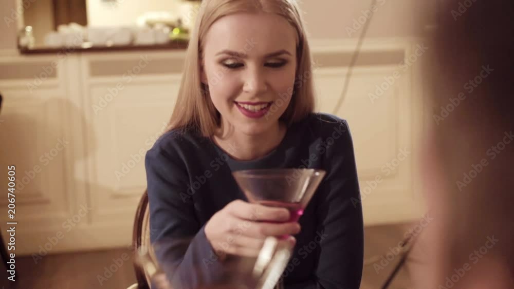 Couple in love. Handsome man flirting with cute woman in restaurant. Bearded man flirting with young sexy blonde Couple in love. Handsome man flirting with cute woman in restaurant. Bearded man flirting with young sexy blonde