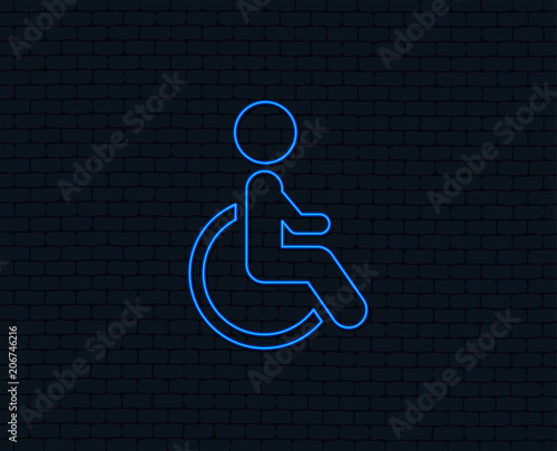 Neon light. Disabled sign icon. Human on wheelchair symbol. Handicapped invalid sign. Glowing graphic design. Brick wall. Vector