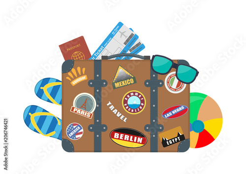 Vector illustration. Tourist suitcase with accessories for rest.