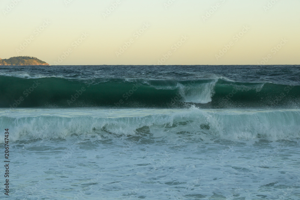 leblon beach rio de janeiro city at sunset with great waves and beautiful abstract colors