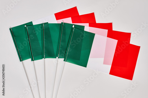 Gathering of Italian flags. Many Italy flags on white isolated background. photo