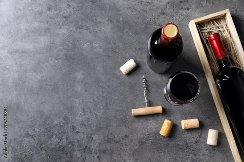Flat lay composition with delicious red wine on grey background
