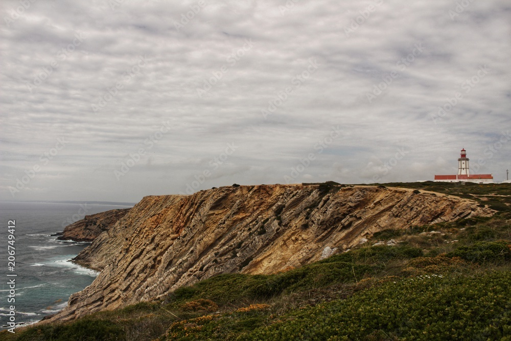 Views of the wild Atlantic Ocean with beautiful cliffs in Cape Espichel
