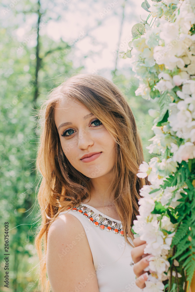 Very beautiful woman in nature surrounded by real flowers. Very beautiful woman in nature surrounded by real flowers.