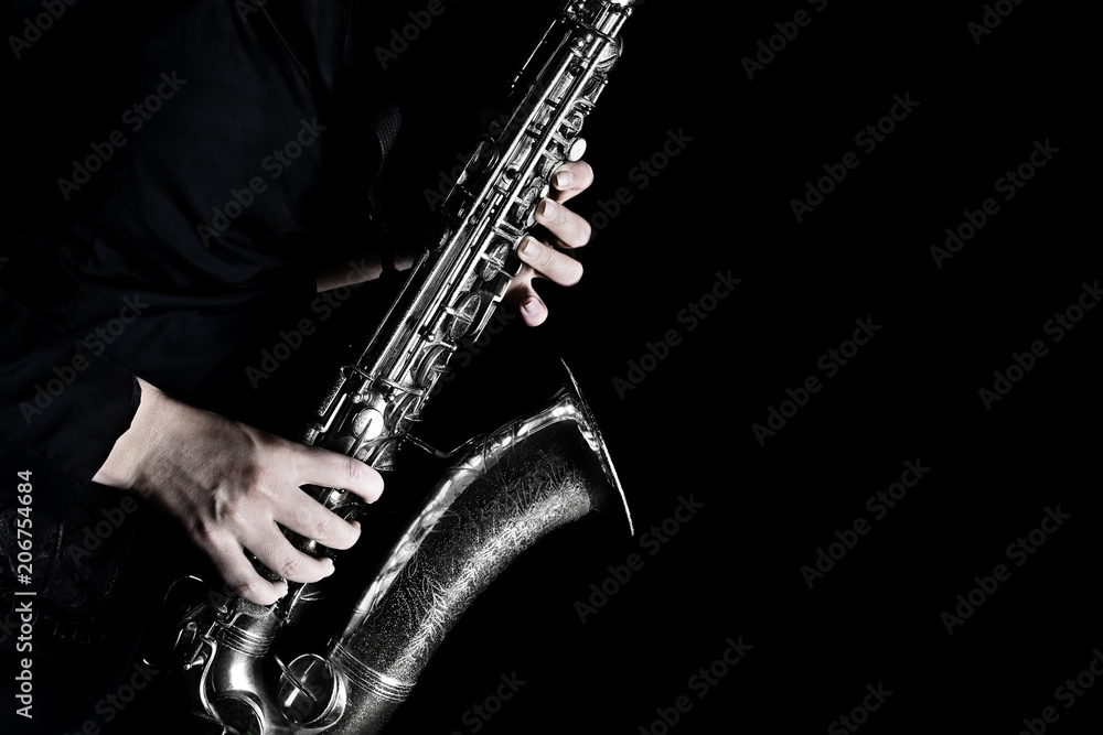 Obraz premium Saxophone player hands closeup. Saxophonist