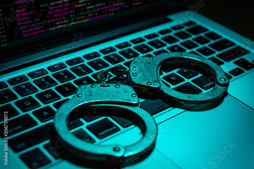 Handcuffs on Computer Keyboard photo
