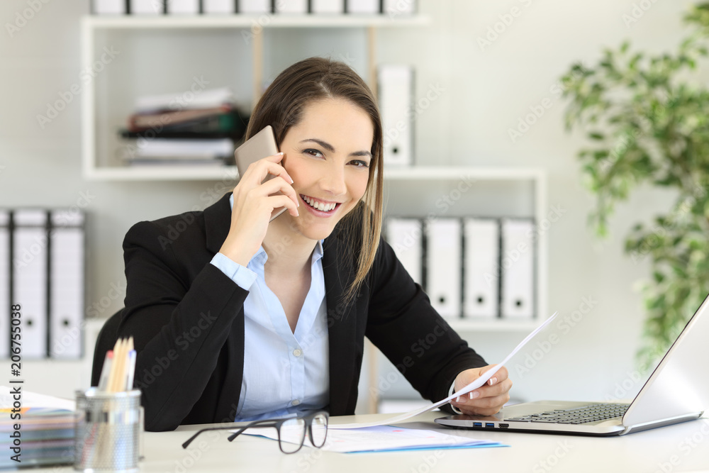 Office worker calling on phone looking at you Office worker calling on phone looking at you