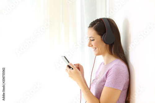 Profile of a teen listening to music selecting songs