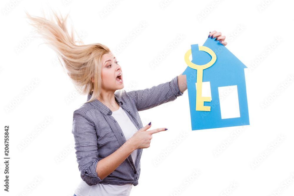 Woman holding paper house model and key. Woman holding paper house model and key.
