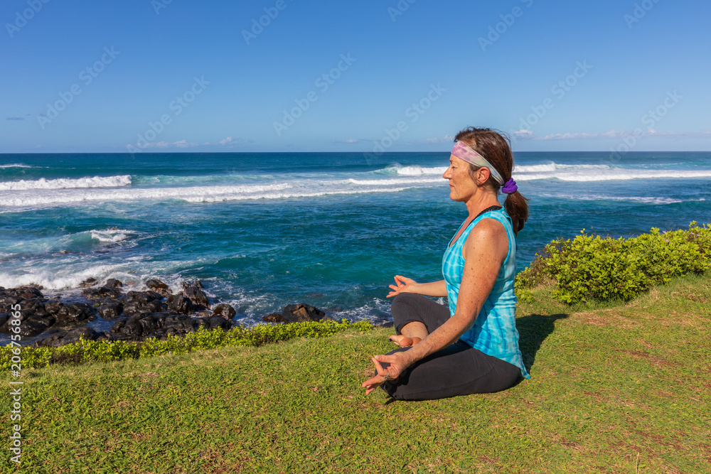 Woman Practicing Yoga on the Maui Coast