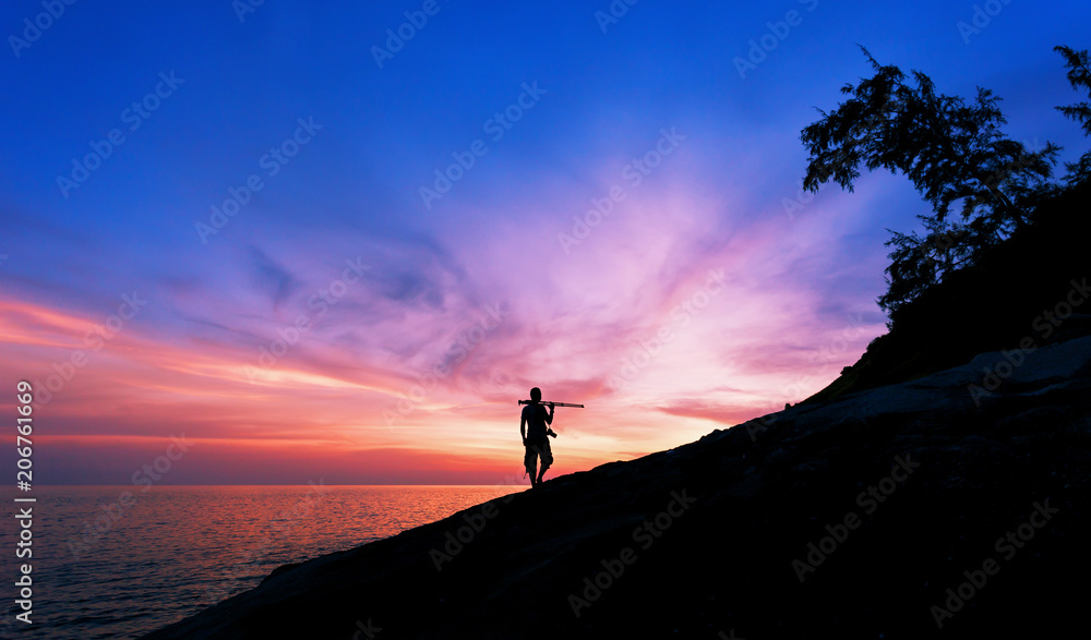 Professional photography on the stones in sunset or sunrise dramatic sky over the tropical sea in phuket thailand.
