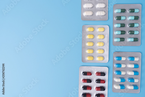 medicine pills on blue background Copy space for text Assorted pharmaceutical Healthy Eating, Lifestyle