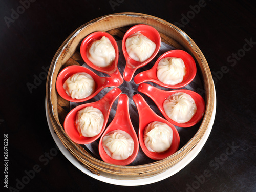 Steamed pork soup dumplings, xiao long tang bao. popular dish in Taiwan photo