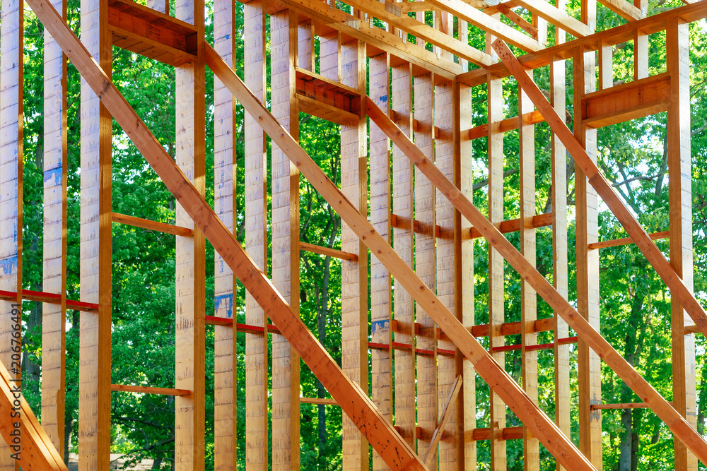 Wood frame of house under beam construction