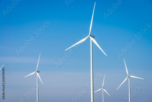 Wind turbines generating electricity with blue sky © pla2na