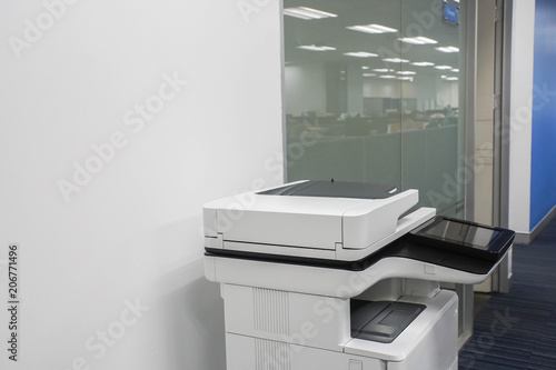 standing multifunction printer in office for printing, copying, scanning documents