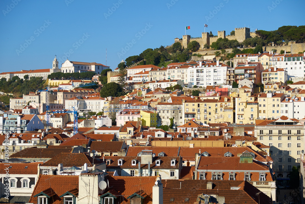 The residential houses of Alfama with Saint George Castle on the background. Lisbon. Portugal