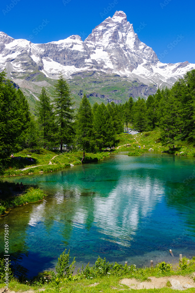 Beautiful landscape with the Matterhorn (Cervino) and another Matterhorn (Cervino) reflected on the Blue Lake (Lago Blu) near Breuil-Cervinia, Aosta, Italy