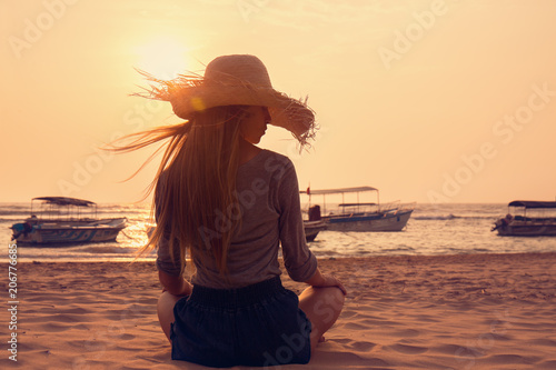 Young woman on the beach © Mallivan