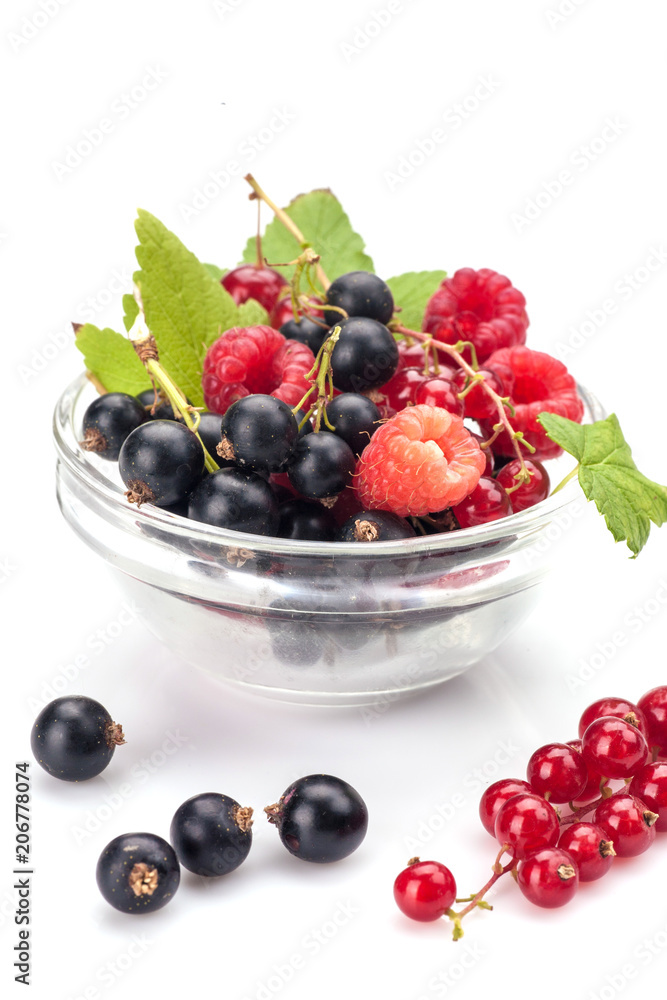 Mixed berries in glass bowl isolated on white background Mixed berries in glass bowl isolated on white background