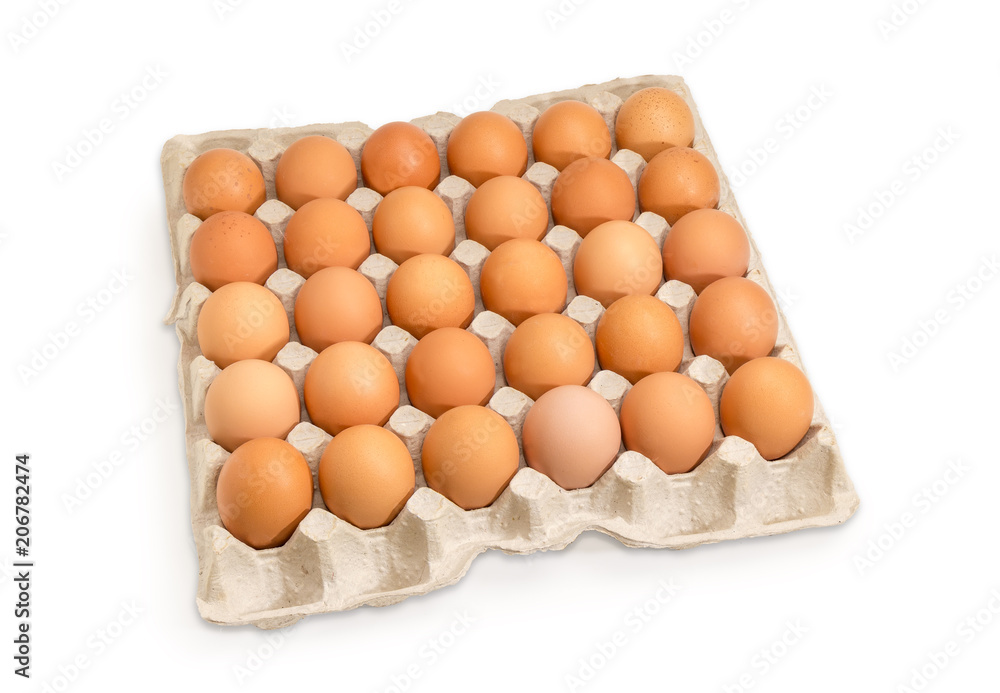 Brown eggs in the cardboard egg tray on white background Brown eggs in the cardboard egg tray on white background