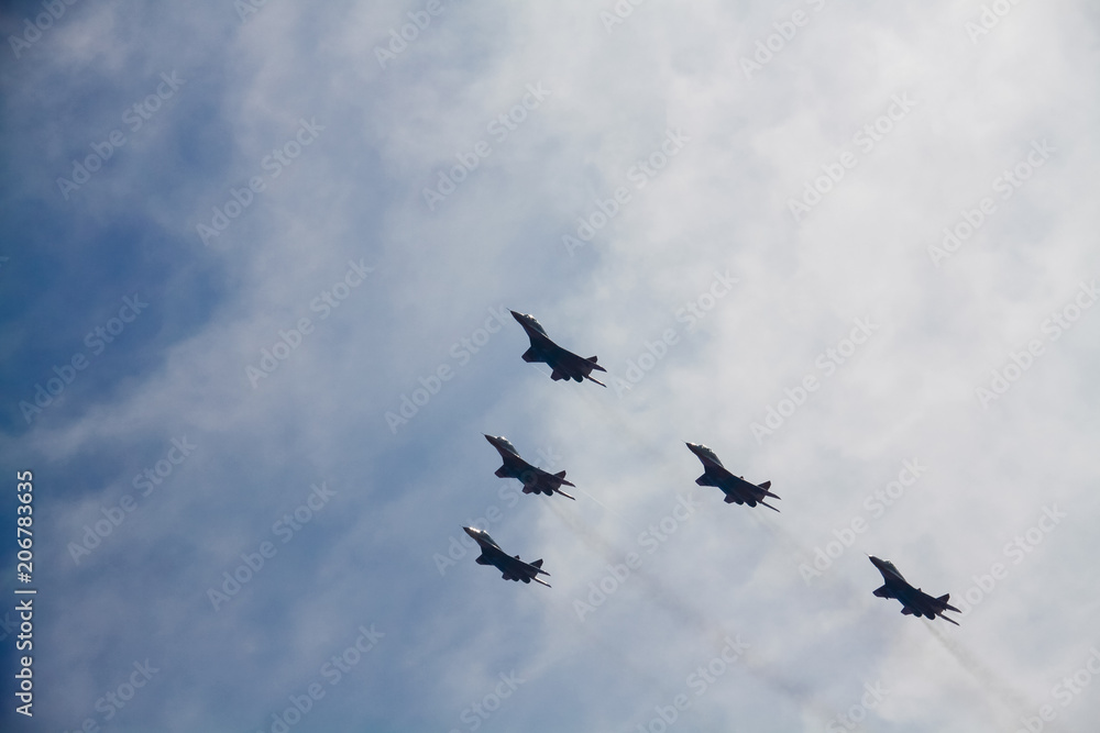 Five military aircraft flying in the sky Five military aircraft flying in the sky