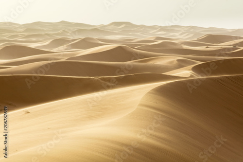 moving sand by dunes in Sahara desert in Morocco