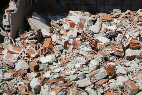 bricks of a completely destroyed wall of a house