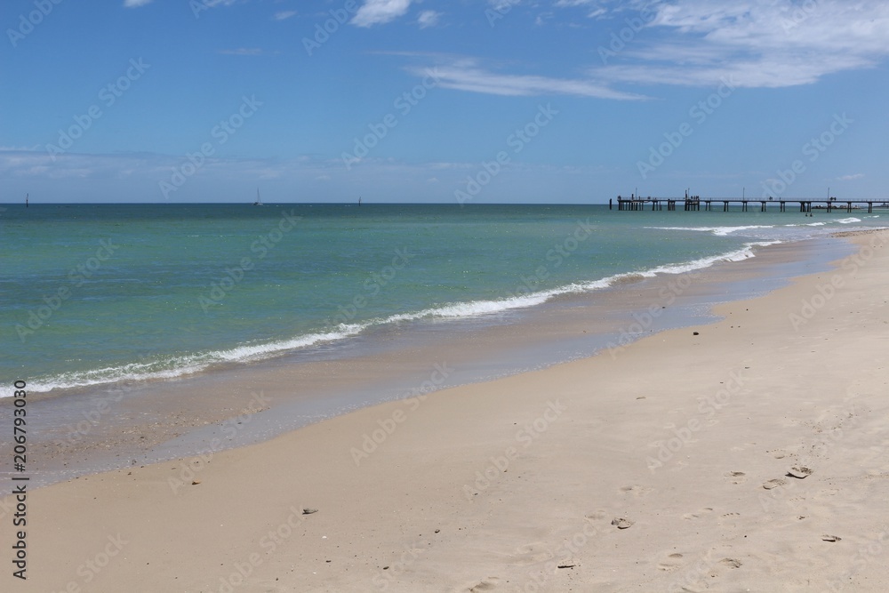 Endless white sand beach with pier In Glenelg, South Australia