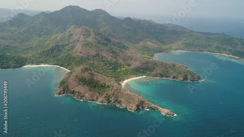 Aerial view of seashore with beach, lagoons and coral reefs. Philippines, Luzon. Coast ocean with tropical beach, turquoise water. Tropical landscape in Asia. © Alex Traveler