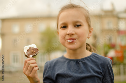 girl eating ice cream on a sunny day
