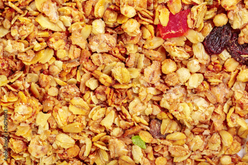 Homemade roasted granola on baking sheet breakfast food background