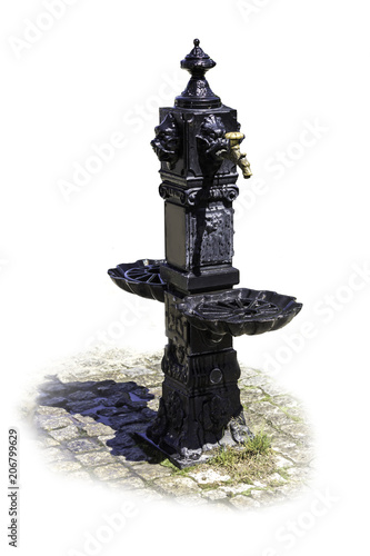 Pulpulak covered with black paint. Copper water tap. Isolated image with a falling shadow on a white background. photo