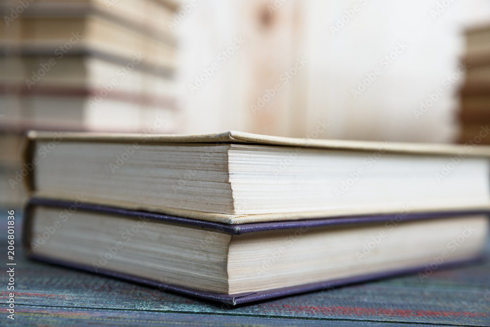 Education and reading concept - group of colorful books on the wooden table Education and reading concept - group of colorful books on the wooden table